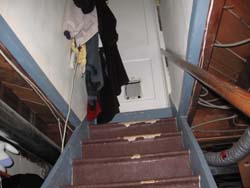clothes hanging on stairs - trip
							hazard